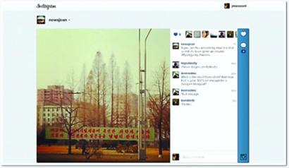 外國(guó)記者吉恩在朝鮮用手機(jī)發(fā)布的第一張Instagram照片平壤街頭的橫幅標(biāo)語(yǔ)。